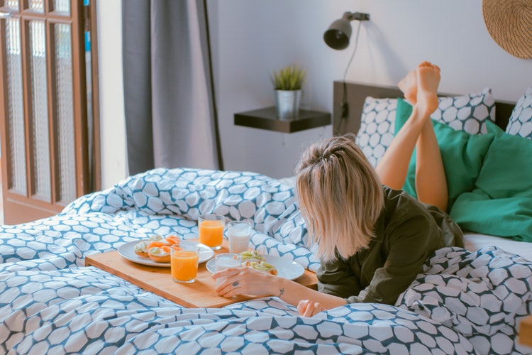 lady relaxing on bed