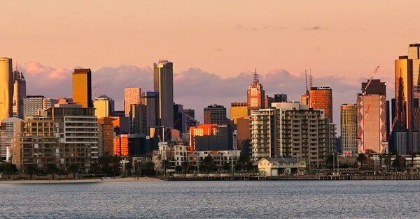 Melbourne skyline and bayside apartments at sunset