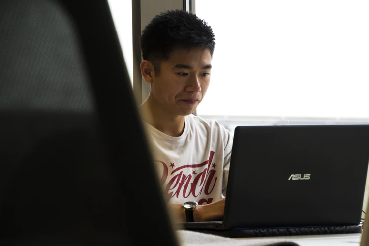 man looking at computer