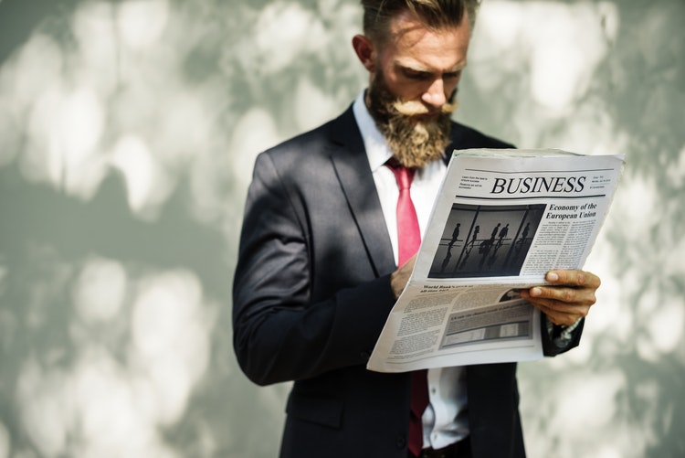 man reading newspaper